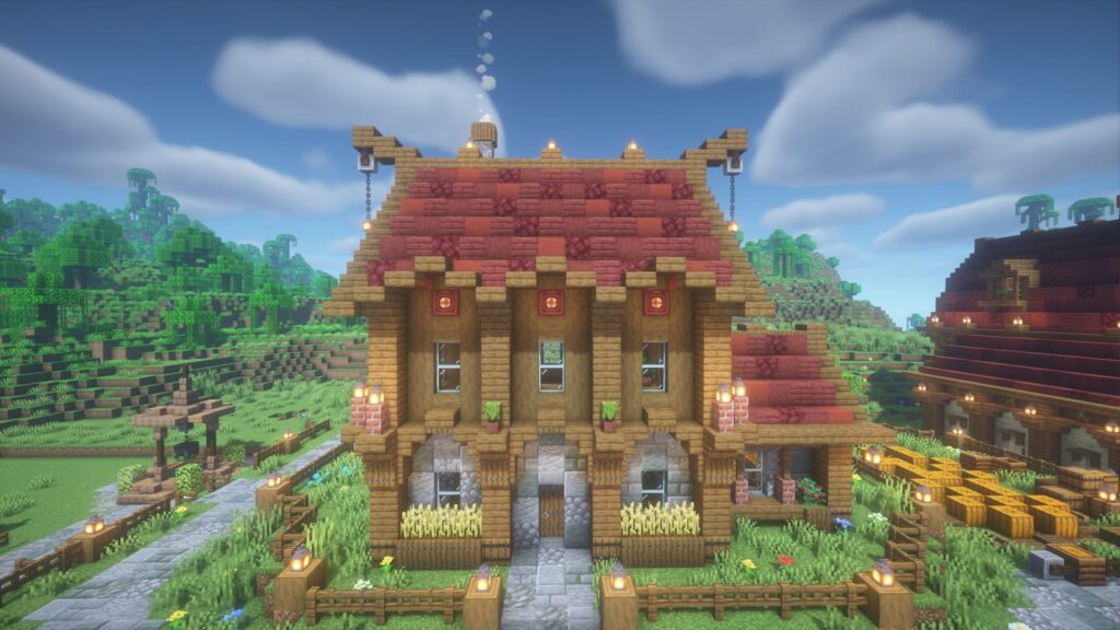 【マイクラ】カボチャ農家の外観(正面)。赤い屋根と壁面の全体デザインに加え、玄関ポーチや建物周辺の装飾アイデア。