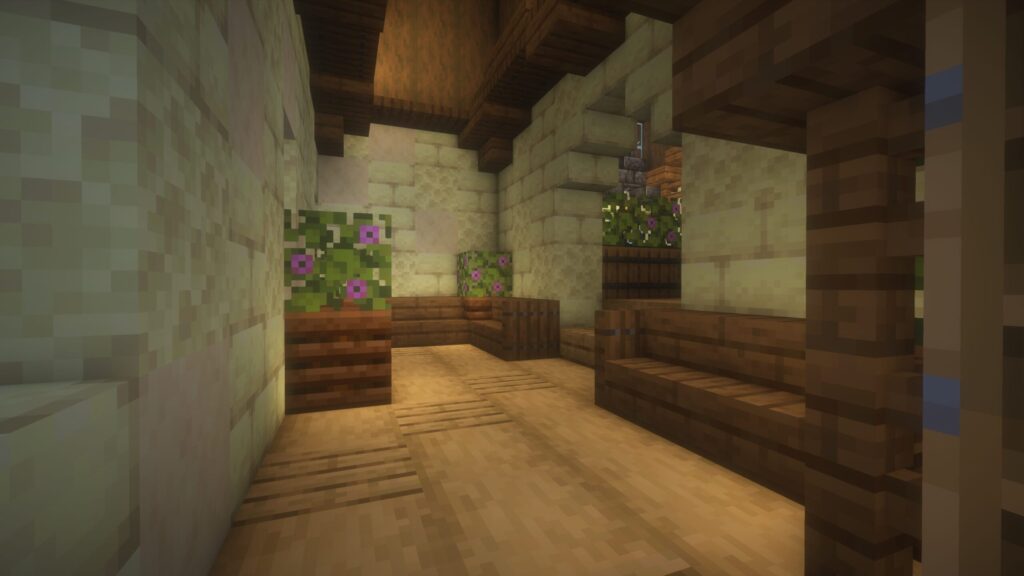 マインクラフトで建築したカフェの待合室。オークの原木と木材を組み合わせた床や、コンポスターを使った観葉植物の装飾が見える。